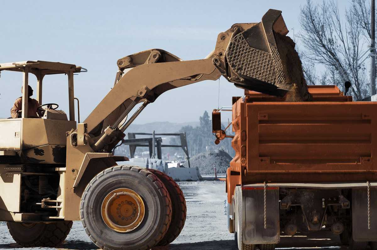 Loader dumping into aggregate truck for Bulk Haulage